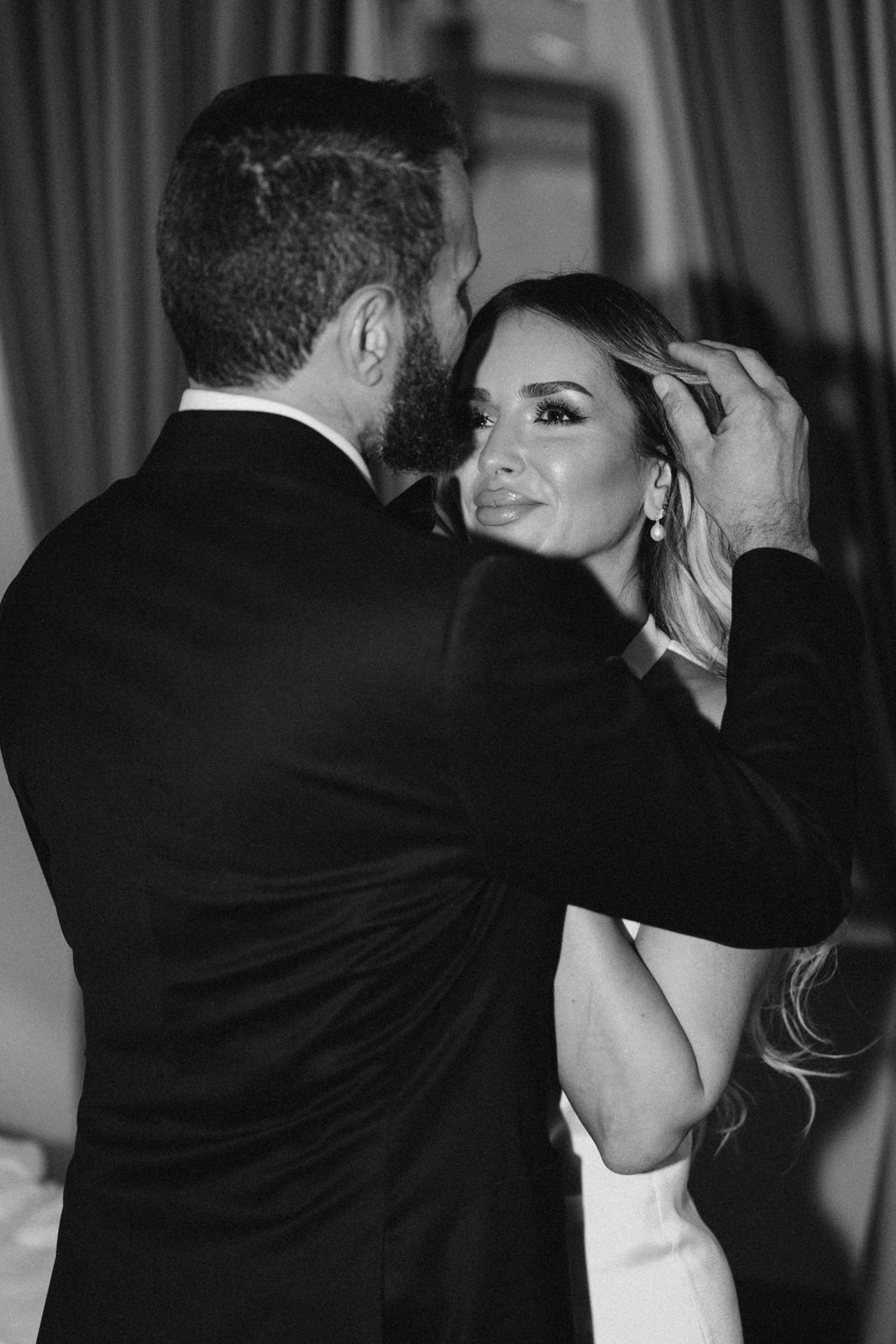 Close emotional moment between bride and groom during elopement